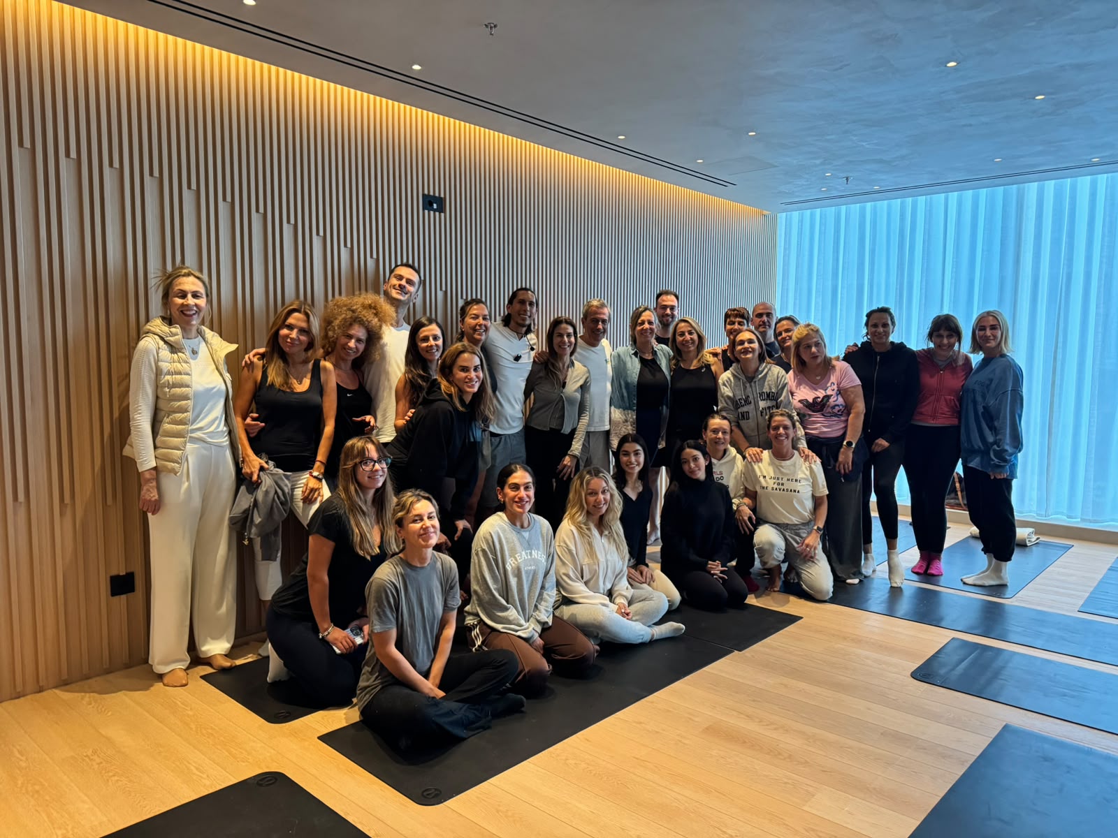 JJ Ruescas with a group of workshop participants in a studio